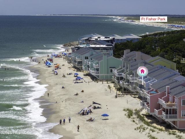 aerial view with a water view and a beach view