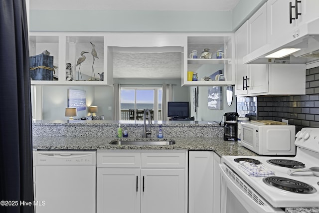 kitchen featuring sink, exhaust hood, white cabinets, and white appliances