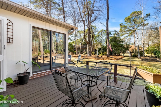 deck with outdoor dining area