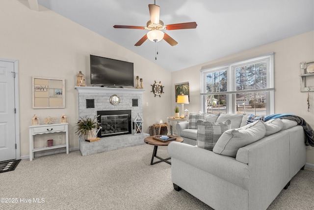 living room with carpet floors, a brick fireplace, vaulted ceiling, ceiling fan, and baseboards