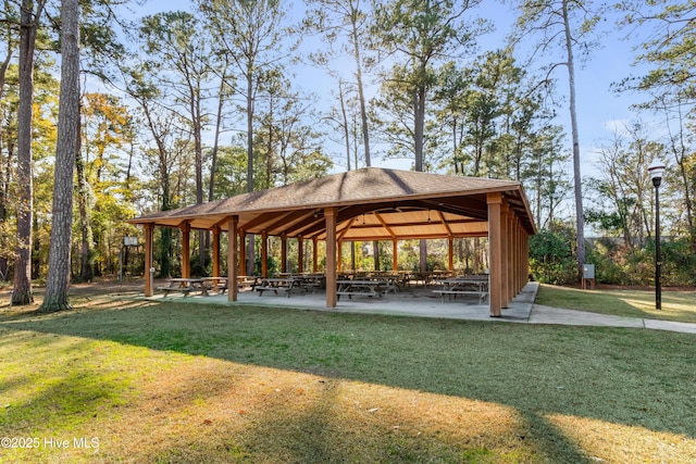 surrounding community with a yard and a gazebo