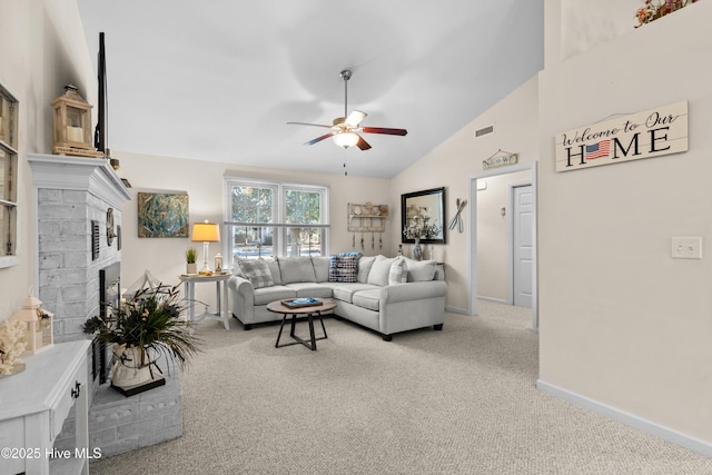 carpeted living room featuring high vaulted ceiling, visible vents, baseboards, a ceiling fan, and a brick fireplace