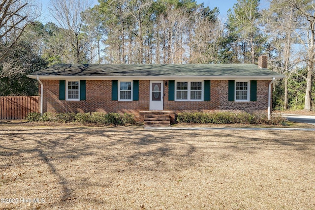 ranch-style home with a front yard