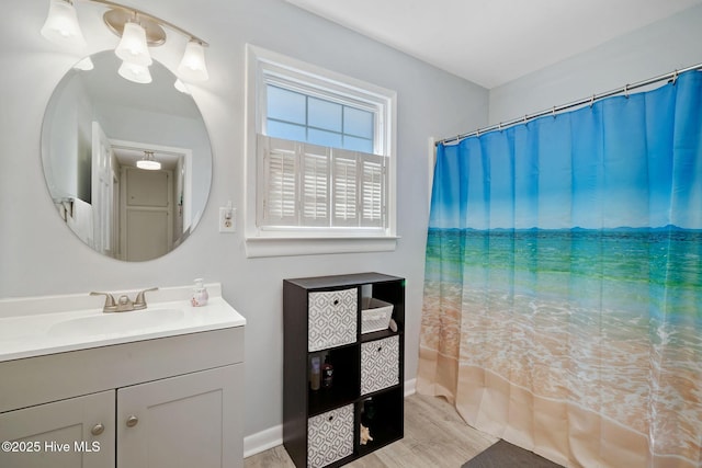 bathroom featuring vanity and hardwood / wood-style floors