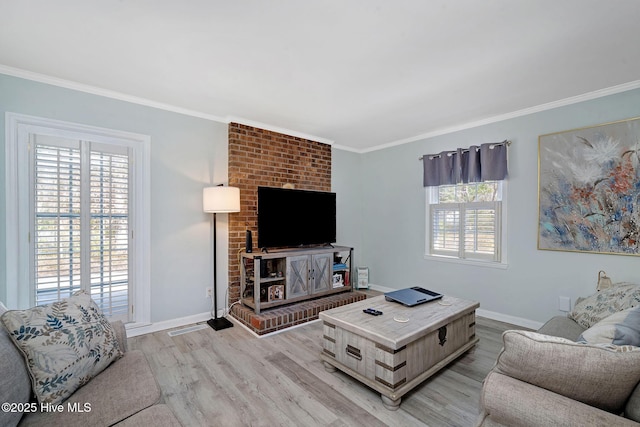 living room featuring crown molding and light hardwood / wood-style flooring