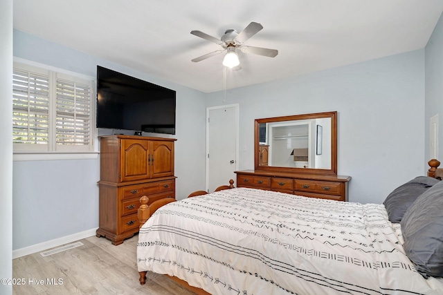 bedroom with ceiling fan and light hardwood / wood-style floors