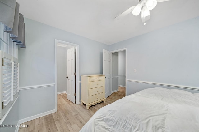 bedroom with ceiling fan and light wood-type flooring