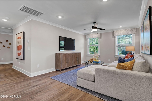 living room with crown molding, hardwood / wood-style floors, and ceiling fan