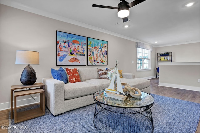 living room with ceiling fan, ornamental molding, and wood-type flooring