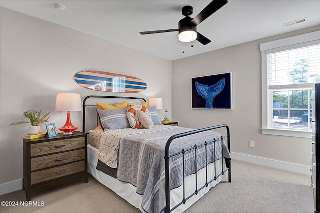 carpeted bedroom featuring ceiling fan