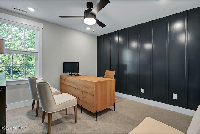 office space with ceiling fan, light colored carpet, and a healthy amount of sunlight