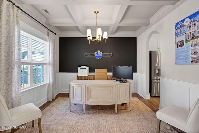 office featuring coffered ceiling, light wood-type flooring, a notable chandelier, and beam ceiling