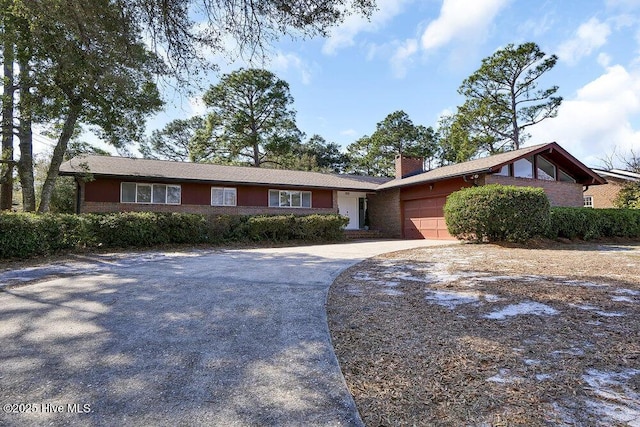 ranch-style home featuring a garage