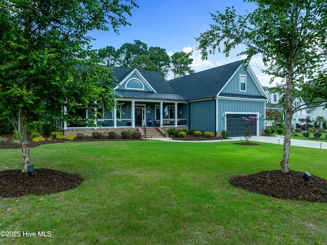 1611 Golfers Ridge Dr SE, Bolivia, NC 28422 - view of front of home featuring a porch, a standing seam roof, board and batten siding, a metal roof, and a front yard