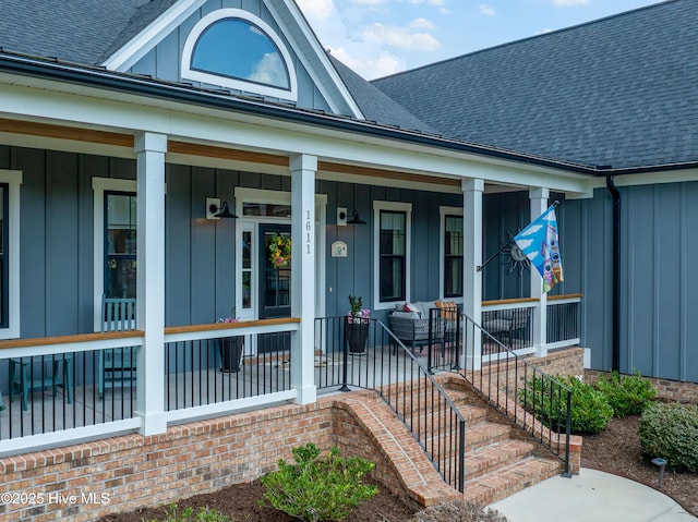 1611 Golfers Ridge Dr SE, Bolivia, NC 28422 - entrance to property featuring board and batten siding, roof with shingles, and covered porch