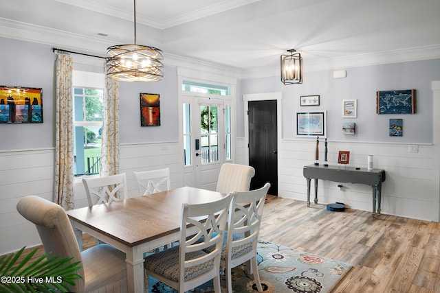 1611 Golfers Ridge Dr SE, Bolivia, NC 28422 - dining room with a chandelier, wainscoting, plenty of natural light, wood finished floors, and ornamental molding