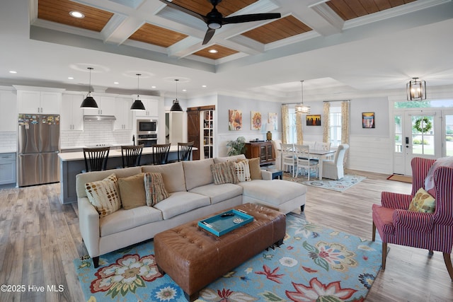 1611 Golfers Ridge Dr SE, Bolivia, NC 28422 - living room featuring a ceiling fan, light wood-style flooring, coffered ceiling, recessed lighting, and ornamental molding