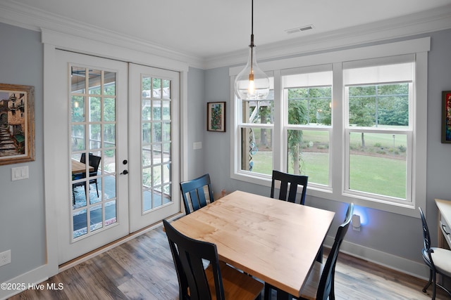 1611 Golfers Ridge Dr SE, Bolivia, NC 28422 - dining area featuring french doors, wood finished floors, and ornamental molding
