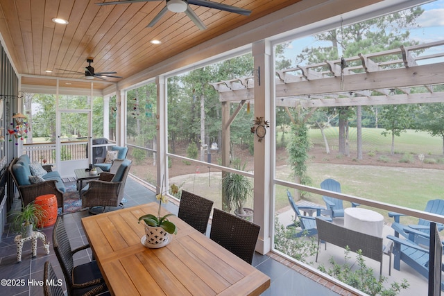 1611 Golfers Ridge Dr SE, Bolivia, NC 28422 - sunroom / solarium featuring a ceiling fan, outdoor dining space, and plenty of natural light