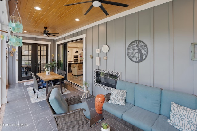 1611 Golfers Ridge Dr SE, Bolivia, NC 28422 - view of patio / terrace featuring a ceiling fan, french doors, and outdoor lounge area