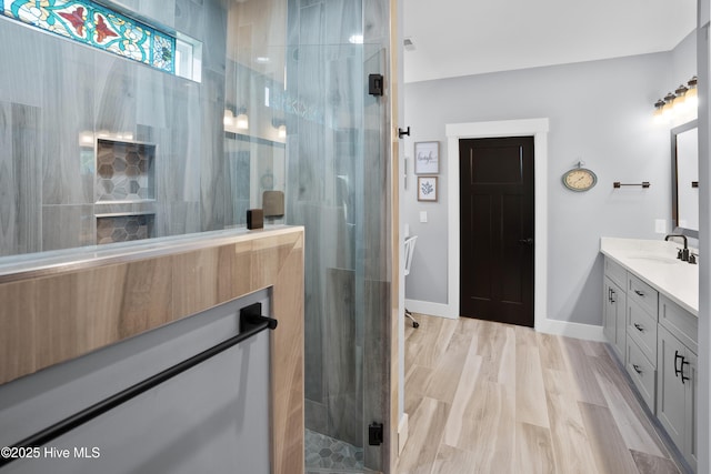 1611 Golfers Ridge Dr SE, Bolivia, NC 28422 - full bathroom with vanity, a stall shower, and wood finished floors