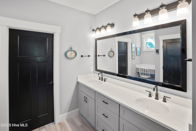 1611 Golfers Ridge Dr SE, Bolivia, NC 28422 - bathroom featuring double vanity and baseboards