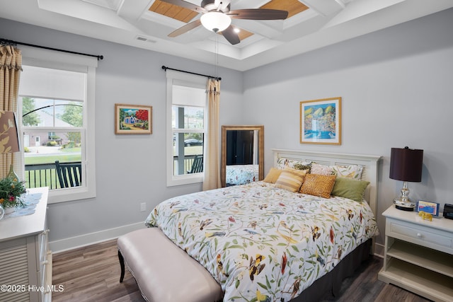 1611 Golfers Ridge Dr SE, Bolivia, NC 28422 - bedroom with coffered ceiling, multiple windows, dark wood finished floors, beamed ceiling, and ceiling fan