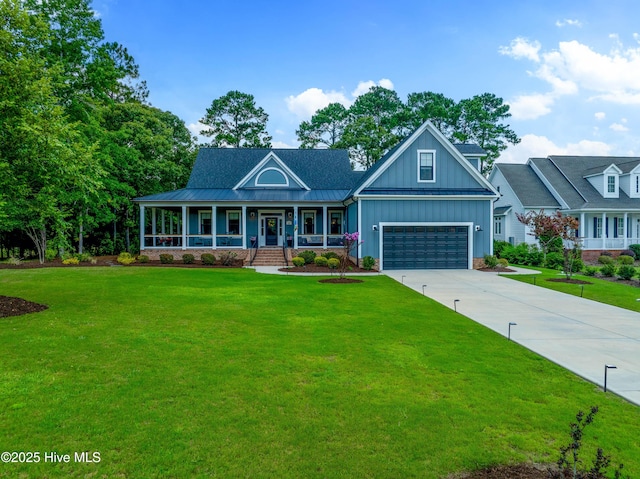 1611 Golfers Ridge Dr SE, Bolivia, NC 28422 - view of front of house with covered porch, board and batten siding, driveway, a front yard, and a standing seam roof