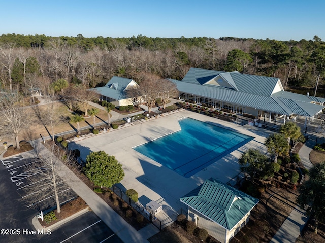 1611 Golfers Ridge Dr SE, Bolivia, NC 28422 - outdoor pool with a view of trees and a patio area