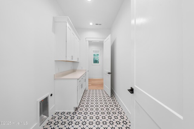 mudroom with light hardwood / wood-style flooring