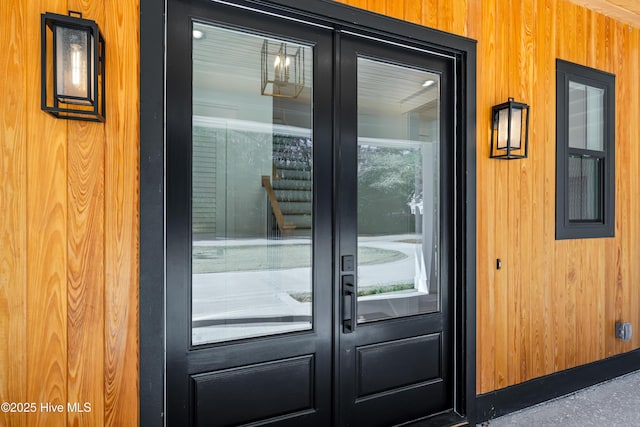 doorway featuring wood walls