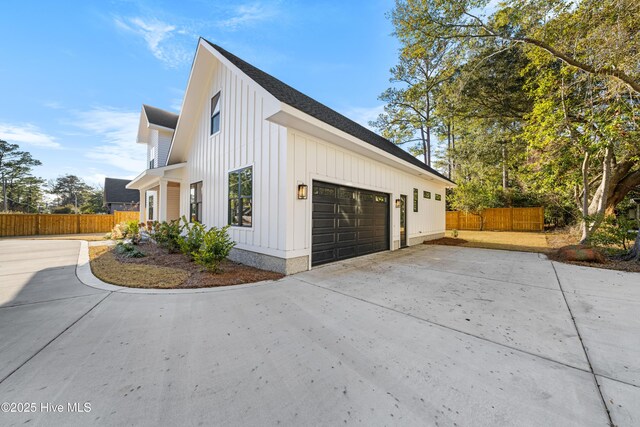 modern inspired farmhouse featuring a garage