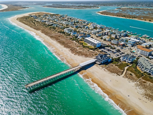 birds eye view of property with a beach view and a water view