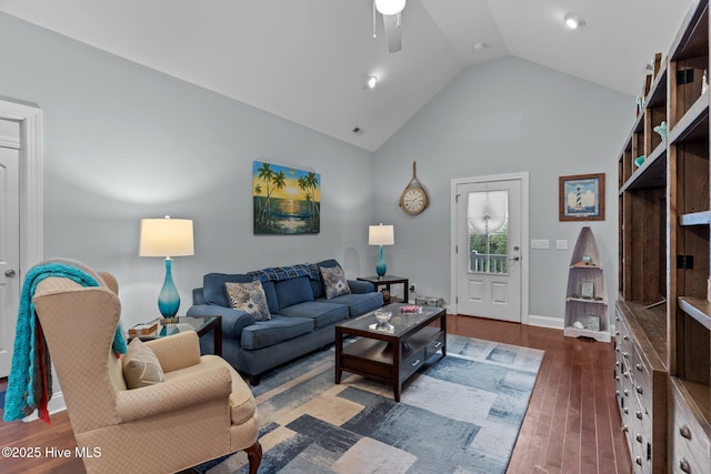 living room featuring ceiling fan, dark hardwood / wood-style floors, and high vaulted ceiling