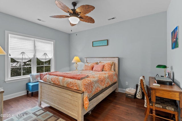 bedroom with ceiling fan and dark hardwood / wood-style floors