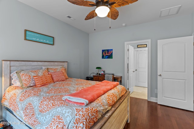 bedroom with ceiling fan and dark hardwood / wood-style flooring