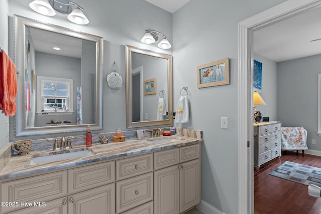 bathroom with vanity and hardwood / wood-style floors