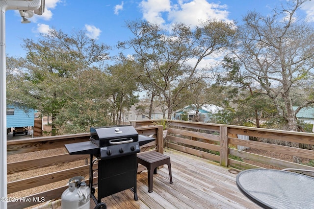 wooden terrace featuring area for grilling