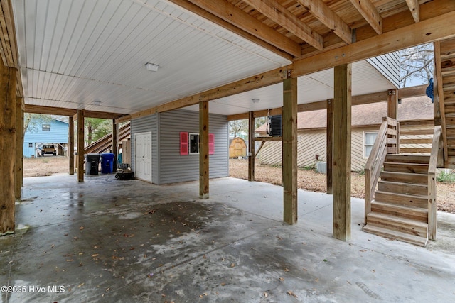 view of patio with an outbuilding