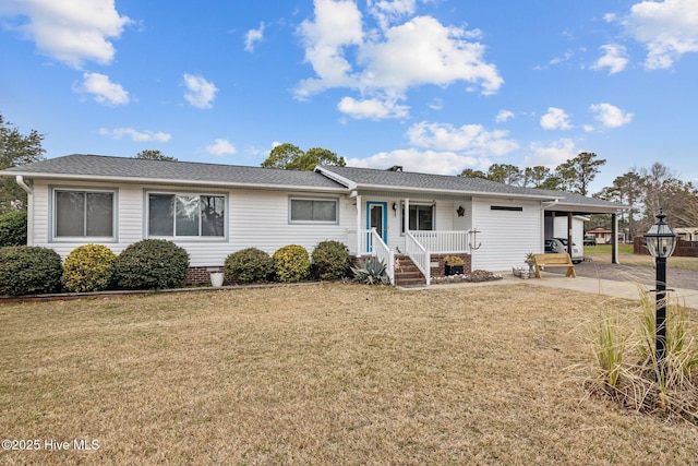 ranch-style house featuring covered porch and a front lawn