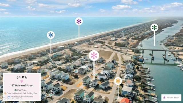 aerial view with a view of the beach and a water view