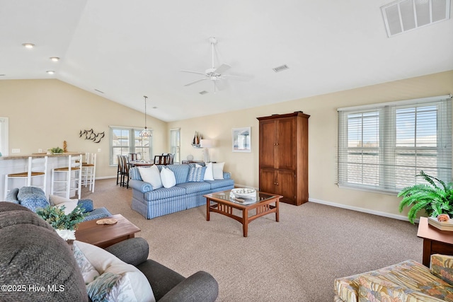 living room with lofted ceiling, light carpet, and ceiling fan