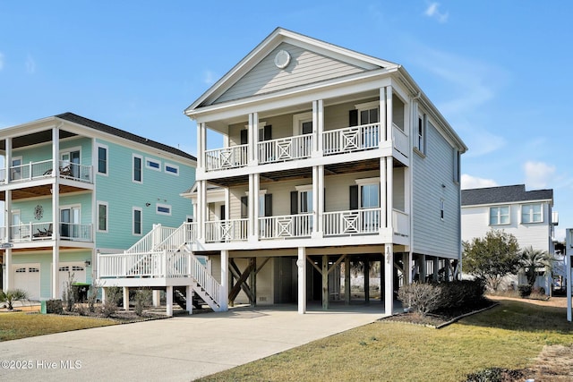 coastal home with a carport, a porch, and a front yard