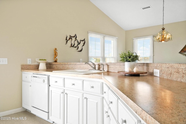 kitchen with vaulted ceiling, pendant lighting, sink, white cabinets, and white dishwasher