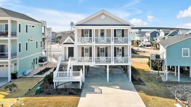 rear view of house featuring a balcony and a carport