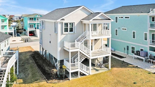 back of property featuring a yard and a patio area