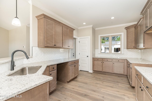 68 Tee Dr, Selma, NC 27576 - kitchen featuring a sink, light wood-style floors, decorative backsplash, crown molding, and light stone countertops