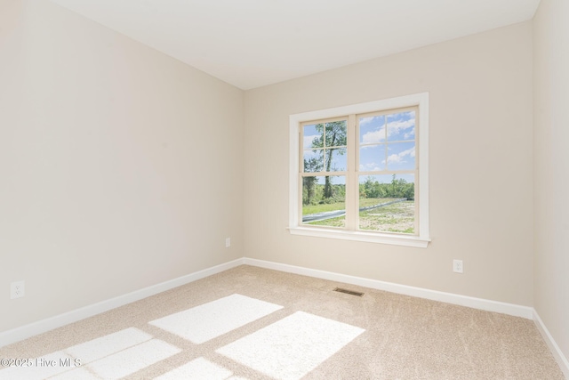 68 Tee Dr, Selma, NC 27576 - spare room with baseboards, visible vents, and carpet