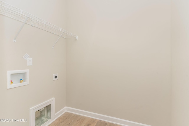 68 Tee Dr, Selma, NC 27576 - washroom with hookup for an electric dryer, light wood-type flooring, baseboards, hookup for a washing machine, and laundry area