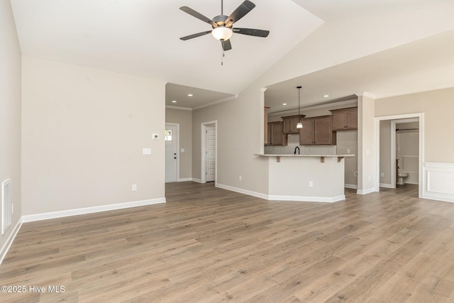68 Tee Dr, Selma, NC 27576 - unfurnished living room with baseboards, a ceiling fan, light wood-type flooring, and recessed lighting